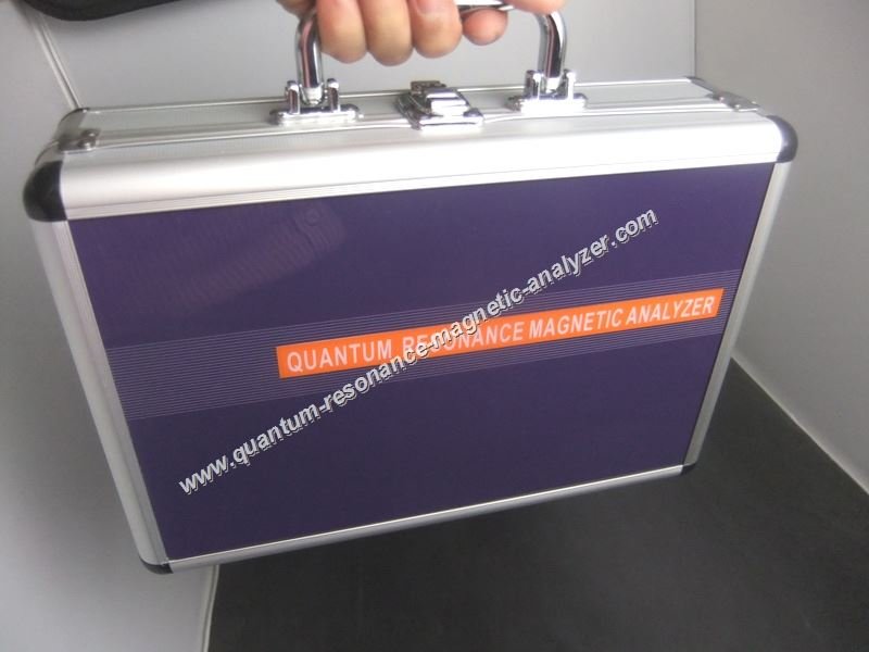 Professional quantum resonance magnetic analyzer device on medical examination table