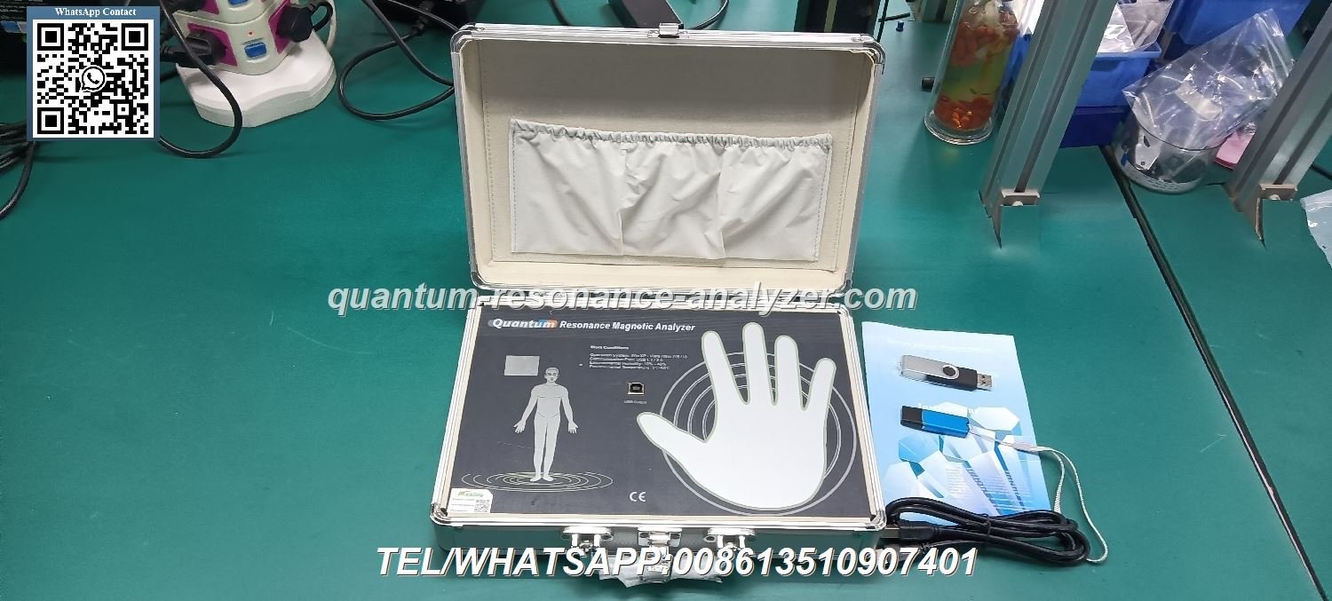 Professional demonstrating quantum magnetic resonance analyzer operation to clinic staff